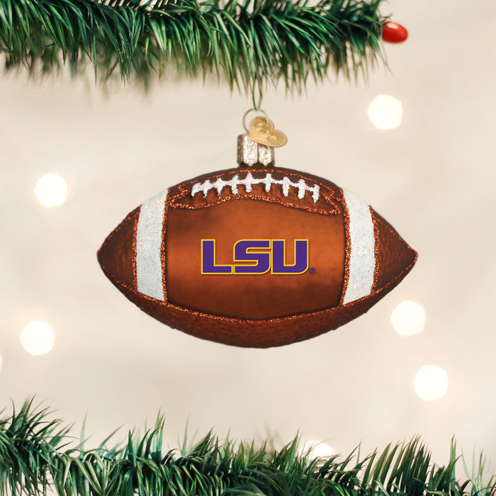 LSU Tigers football glass Christmas ornament hanging on a lit tree
